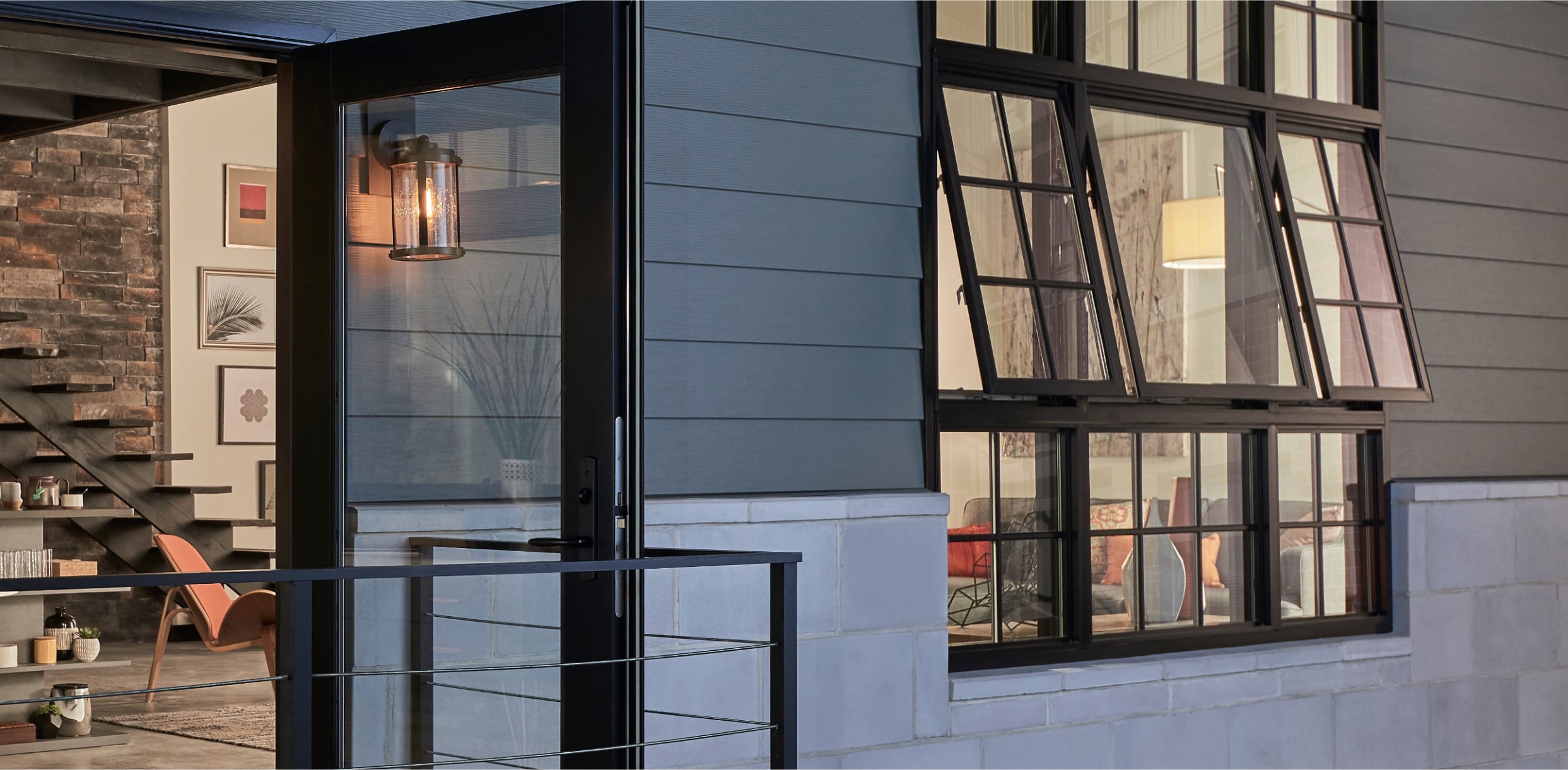 Exterior Black MIRA Awning Windows with Colonial Grilles